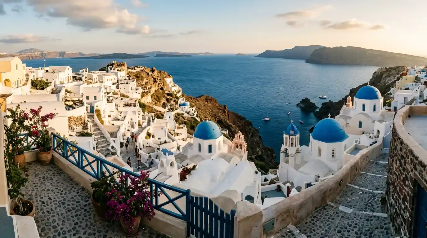 Whitewashed Santorini buildings overlooking the blue Aegean Sea in Greece.