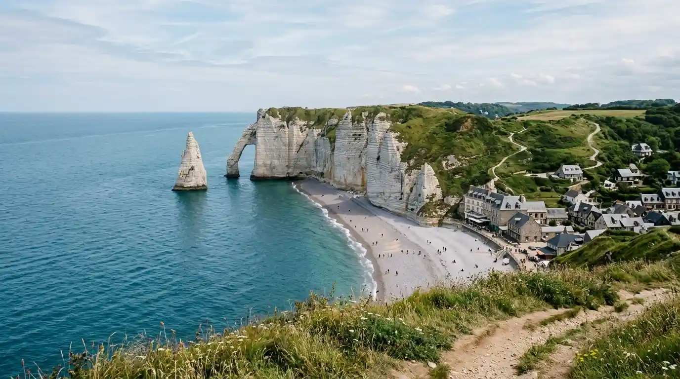 White chalk cliffs and natural rock arch overlooking the English Channel at Étretat, Normandy, France.